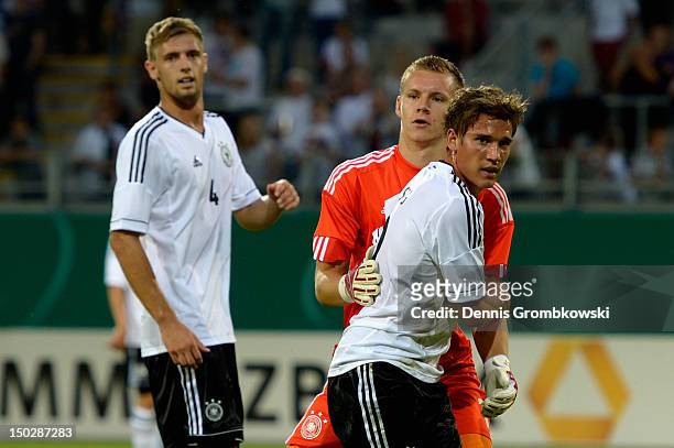 Oliver Sorg of Germany and teammate Bernd Leno hug during the Under 21 international friendly match between Germany U21 and Argentina U21 at...