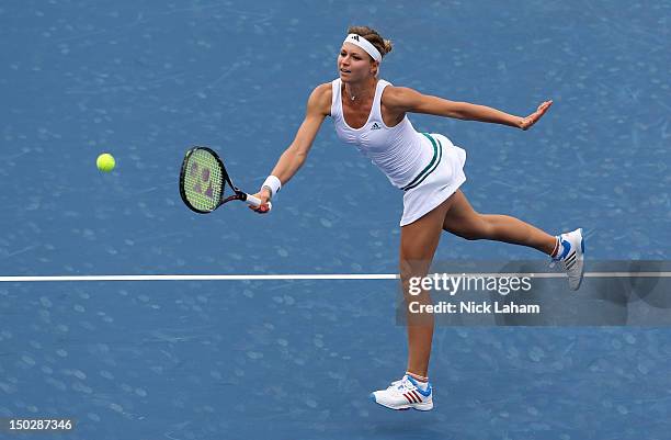 Maria Kirilenko of Russia hits a forehand volley against Venus Williams during day four of the Western & Southern Open at Lindner Family Tennis...