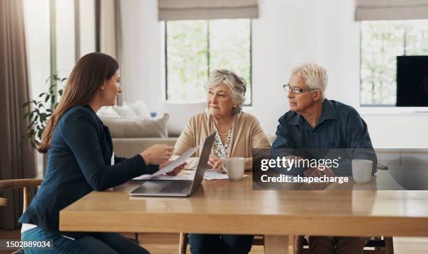 senior couple, meeting and investment with a financial advisor, lawyer or woman consulting on a contract, loan or deal. signature, documents and people with a mortgage, debt or saving in retirement - grounds stock pictures, royalty-free photos & images