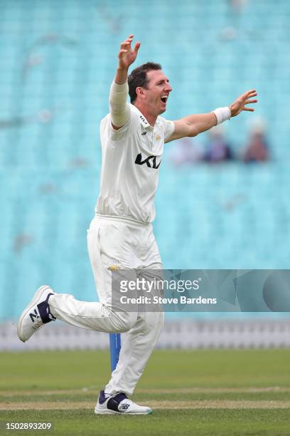 Dan Worrall of Surrey celebrates after taking the wicket of Daryl Mitchell of Lancashire caught by Rory Burns during the LV= Insurance County...