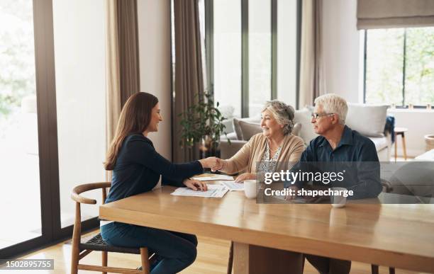 handshake, broker or happy old couple consulting in meeting for retirement pension or tax bill advice. financial advisor, elderly man or senior woman shaking hands for investment deal or savings plan - advice stock pictures, royalty-free photos & images