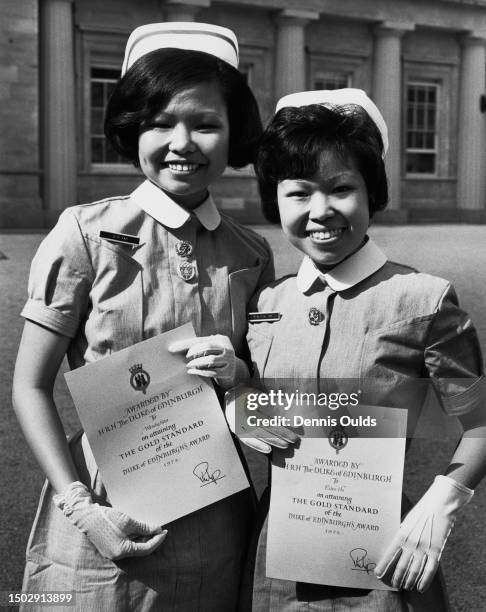 Nurses Wendy Kan and Ellen Ho after receiving their Duke of Edinburgh Scheme Awards at Buckingham Palace in London, England, 2nd May 1972. Both...