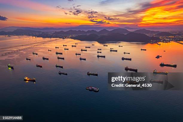 top view aerial oil tanker cargo ship with beautiful sky in sunset time. - floating piers ストックフォトと画像