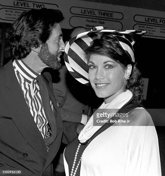 Model Barbi Benton and real estate developer husband George Gradow arrive at A Night at The Races charity fundraiser at Hollywood Park Race Track to...