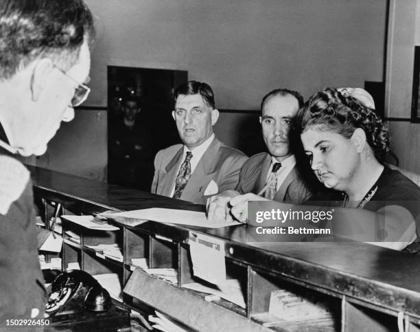 Serial killers Raymond Fernandez and Martha Beck at a New York police station after being extradited from Michigan, March 15th 1949.