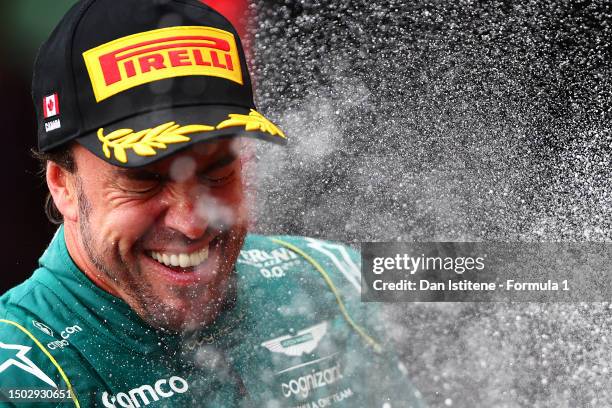 Second placed Fernando Alonso of Spain and Aston Martin F1 Team celebrates on the podium during the F1 Grand Prix of Canada at Circuit Gilles...