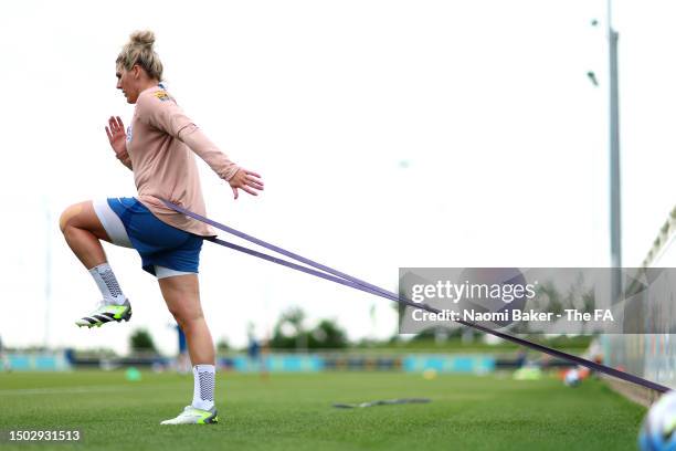 Millie Bright of England stretches during an England Training Session at St George's Park on June 27, 2023 in Burton upon Trent, England.