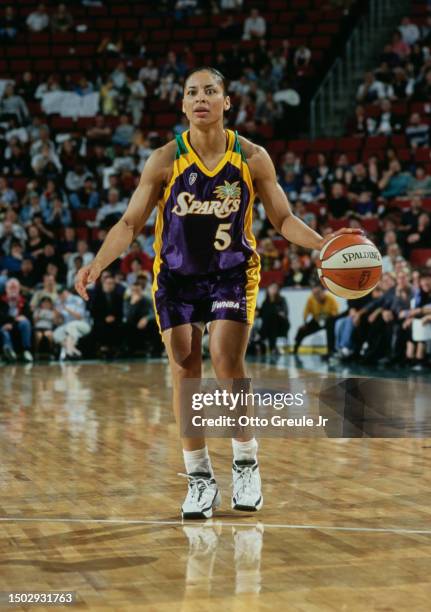 Allison Feaster, Forward for the Los Angeles Sparks in motion dribbling the basketball downcourt during the WNBA Western Conference basketball game...