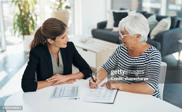 contract, advisor and senior woman signing for insurance, savings or retirement plan. elderly client and a banker, broker or finance consultant person with a document for agreement and signature - female likeness stock pictures, royalty-free photos & images