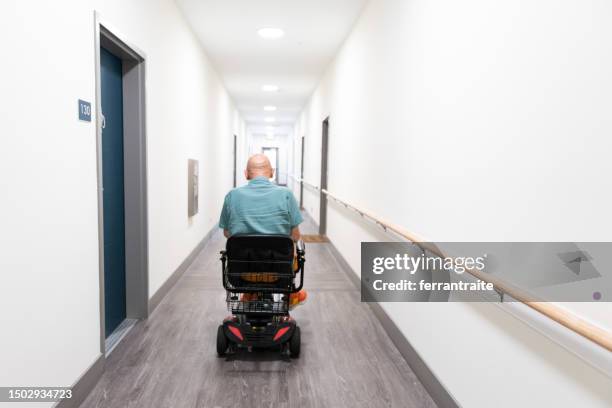 disabled senior rides a mobility scooter - mobility scooters stock pictures, royalty-free photos & images