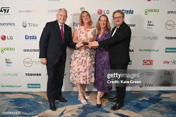 Huw Edwards, Claire Popplewell, guest and Fergal Keane with the Live Event award for The State Funeral of HM Queen during The TRIC Awards 2023 at...