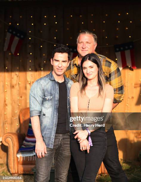 Kelly Jones, Dwight Baker and Patty Lynn of Far From Saints pose backstage after performing on Day 1 of Black Deer Festival 2023 at Eridge Park on...