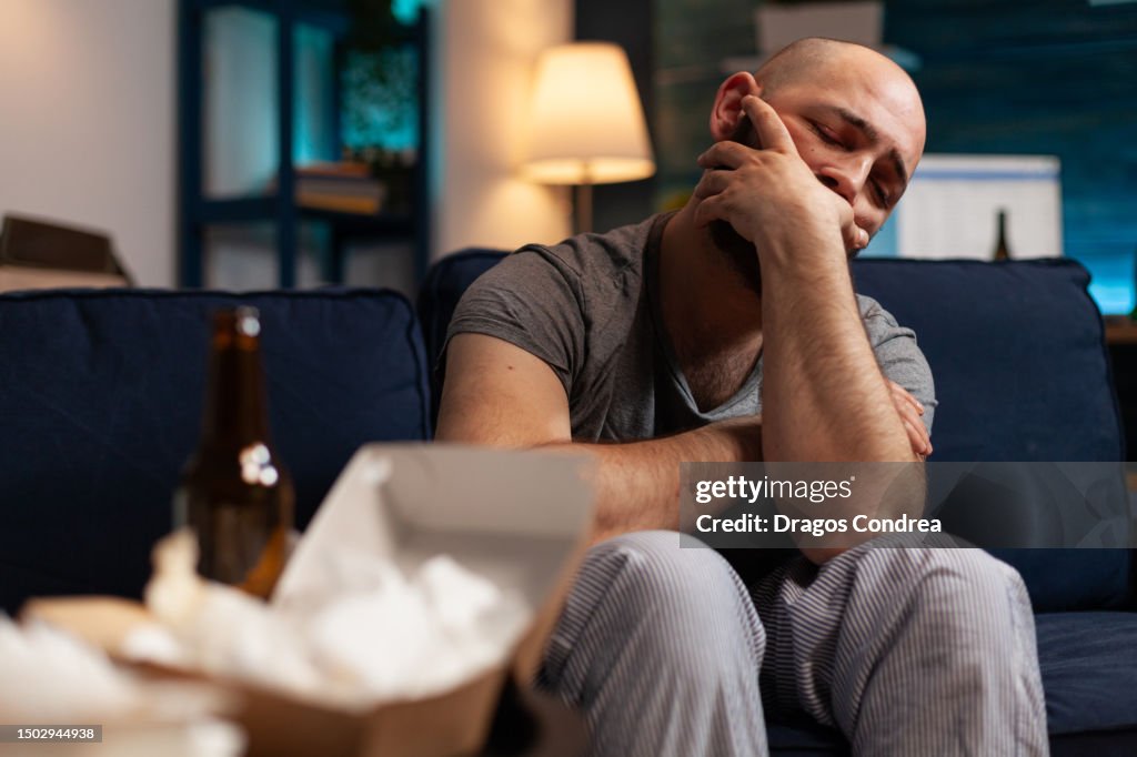 Stressed injured traumatised, frustrated man looking in distance