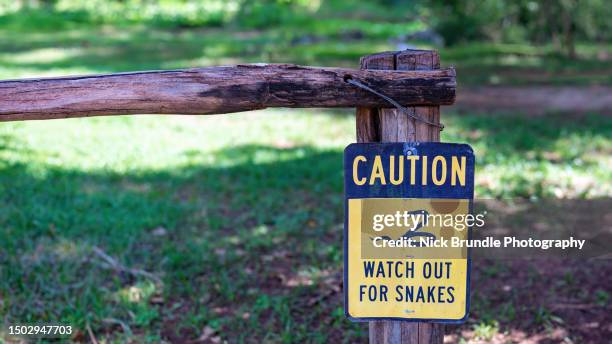 watch out for snakes. - snake warning signs stock pictures, royalty-free photos & images