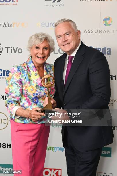 Angela Rippon and Huw Edwards with the Live Event award for 'The State Funeral of HM Queen' during The TRIC Awards 2023 at Grosvenor House on June...