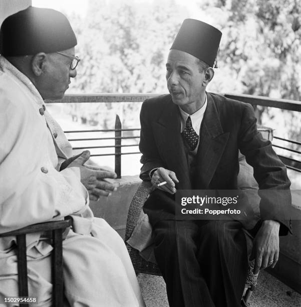 Egyptian diplomat and politician Abdul Rahman Hassan Azzam , Secretary-General of the Arab League, seated on right in conversation with Egyptian...