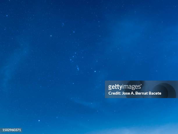 full frame of the night sky with many sparkling stars on a blue sky. - blue hour imagens e fotografias de stock