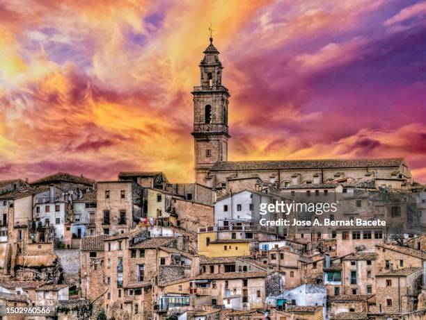 crowded houses of a small town with medieval architecture at sunset. - spain landscape stock pictures, royalty-free photos & images