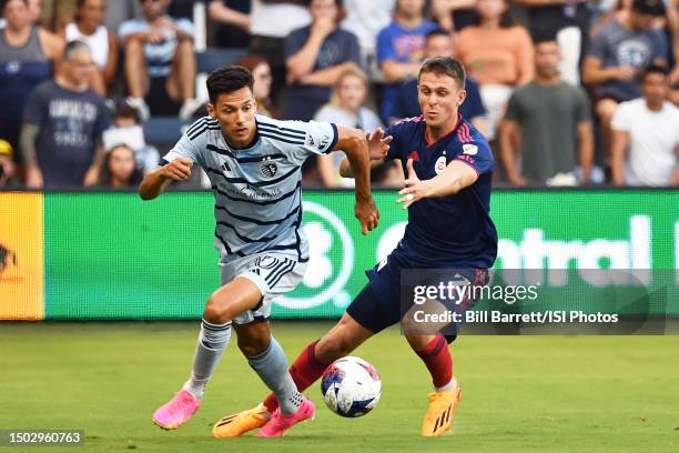 Daniel Salloi of Sporting Kansas City and Arnaud Souquet of Chicago Fire fight for the ball during a game between Chicago Fire FC and Sporting Kansas...