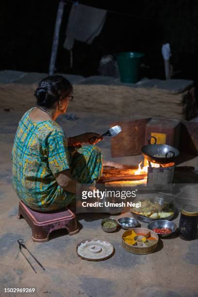 indian village women cooking food outdoor - uttarakhand stock pictures, royalty-free photos & images