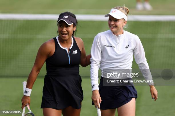 Heather Watson celebrates a point with their partner Harriet Dart of Great Britain in the Women's Doubles First Round match against Yang Zhaoxuan of...