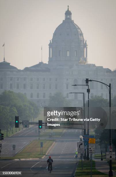 Smoke from Canadian wildfires hangs over the Minnesota State Capitol building, Tuesday, June 27, 2023 in St. Paul, Minnesota. Smoke from two...