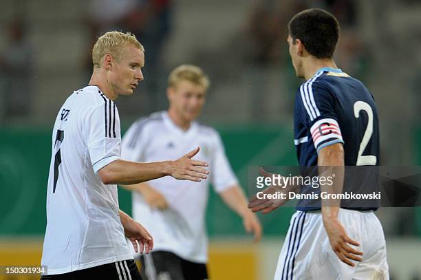 Sebastian Rode of Germany and Lisandro Magallan of Argentina shake hands after the Under 21 international friendly match between Germany U21 and...