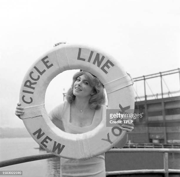 American actress Tina Louise poses for a portrait holding a life preserver for the Circle Line in New York, New York, June 26, 1981.