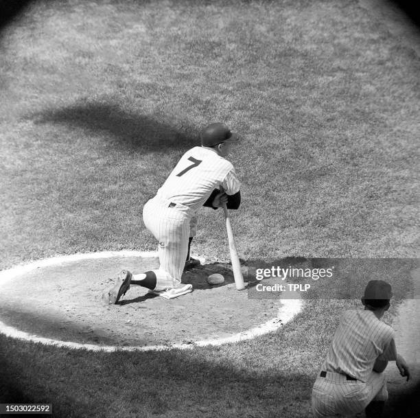 Mickey Mantle of the New York Yankees waits in the on-deck circle during an MLB game against the Kansas City Athletics at Yankee Stadium in the...