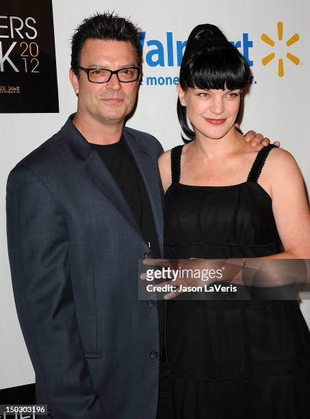 Actress Pauley Perrette and Thomas Arklie attend the "Teachers Rock" benefit at Nokia Theatre L.A. Live on August 14, 2012 in Los Angeles, California.