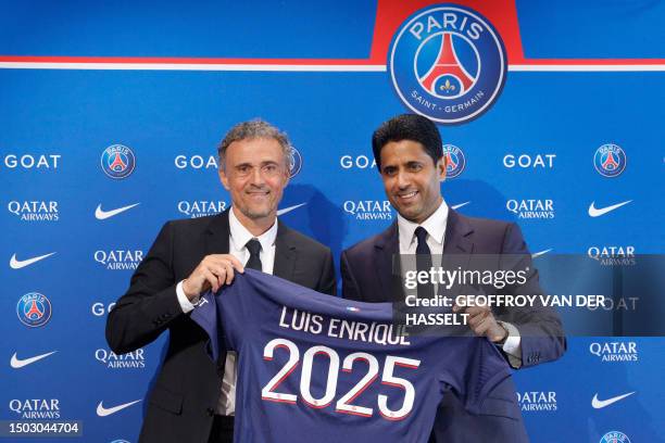 Paris Saint-Germain's newly appointed Spanish head coach Luis Enrique and Paris Saint Germain's Qatari president Nasser al-Khelaifi pose during a...