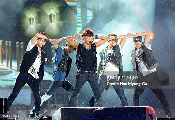 Members of South Korean boy band SHINee perform onstage during at KBS London Olympic Athletes Welcomed The National Festival on August 14, 2012 in...