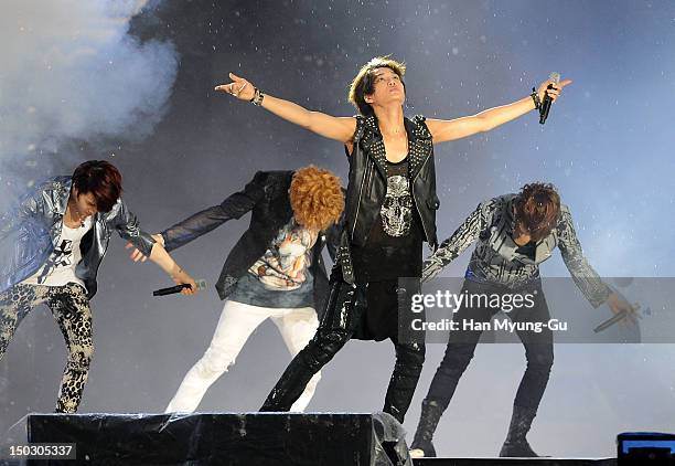 Members of South Korean boy band EXO-K perform onstage during at KBS London Olympic Athletes Welcomed The National Festival on August 14, 2012 in...