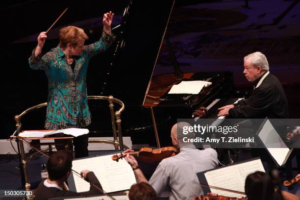 American conductor Marin Alsop leads the Sao Paulo Symphony Orchestra as Brazilian pianist Nelson Freire performs "Momoprecoce" by composer Heitor...