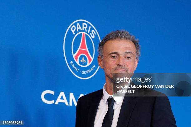 Paris Saint-Germain's newly appointed Spanish head coach Luis Enrique leaves at the end of a press conference to announce the presentation of the new...