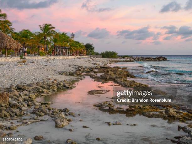 sunset on the island of bonaire in the southern caribbean - bonaire stock pictures, royalty-free photos & images