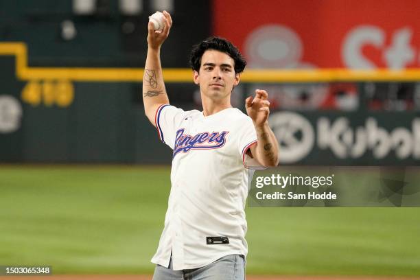 Singer-songwriter Joe Jonas throws out a first pitch before the game between the Texas Rangers and the Detroit Tigers at Globe Life Field on June 27,...