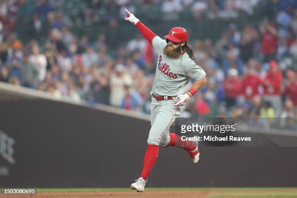 Brandon Marsh of the Philadelphia Phillies celebrates as he rounds the bases after hitting a two-run home run off Jameson Taillon of the Chicago Cubs...