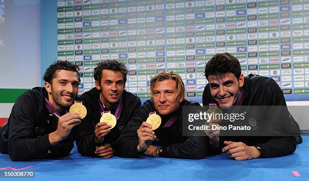 Giorgio Avola, Andrea Baldini, Valerio Aspromonte and Andrea Cassara of Italy pose with bronze medals in Men's Foil Team Fencing at Casa Italia...