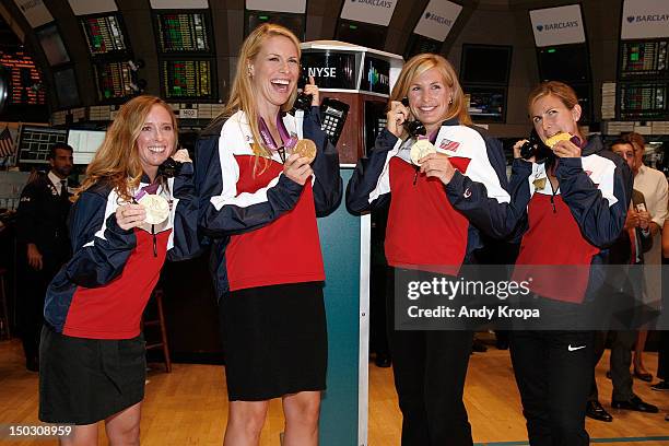 Olympic gold medalists in Women's Rowing Mary Whipple, Esther Lofgren, Meghan Musnicki and Erin Cafaro ring the opening bell at the New York Stock...