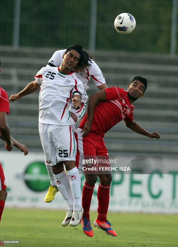 Iran's Omid Nazari (L) vies for the ball