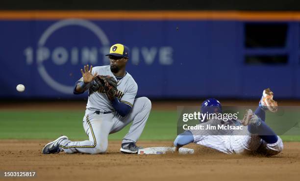 Pete Alonso of the New York Mets beats the throw to Andruw Monasterio of the Milwaukee Brewers as he steals second base in the sixth inning at Citi...