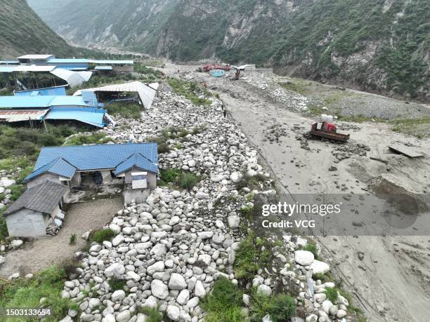 Aerial view of a landslide site on June 27, 2023 in Wenchuan County, Sichuan Province of China. Seven people have been missing after landslides hit...