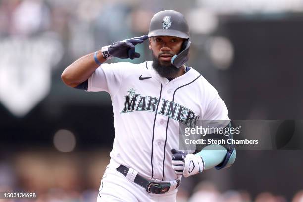 Teoscar Hernandez of the Seattle Mariners reacts after his two-run home run during the first inning against the Washington Nationals at T-Mobile Park...