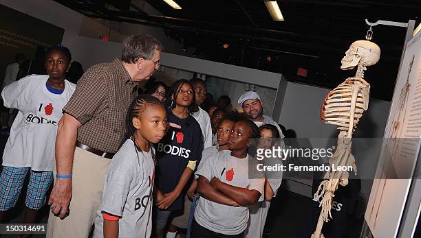 Dr. Roy Glover leading BCGA children around "Bodies...The Exhibition" at South Street Seaport on August 15, 2012 in New York City.