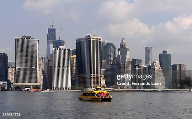 New York Water Taxi carries a Huge Heart Statue to it's unveiling at "Bodies...The Exhibition" at South Street Seaport on August 15, 2012 in New York...