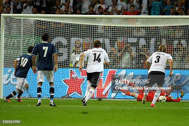 Goalkeeper Marc-Andre ter-Stegen of Germany saves a penalty shot by Lionel Messi of Argentina during the international friendly match between Germany...