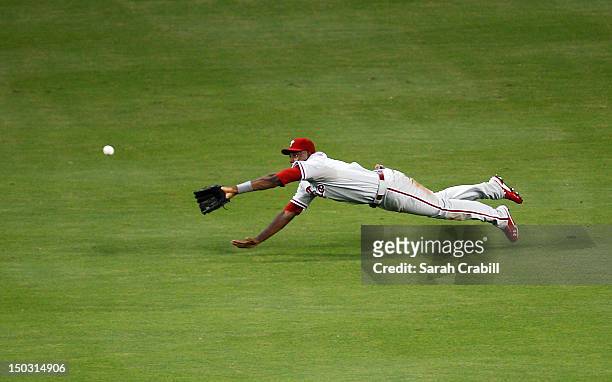 John Mayberry Jr. #15 of the Philadelphia Phillies misses a catch during a game against the Miami Marlins at Marlins Park on August 15, 2012 in...