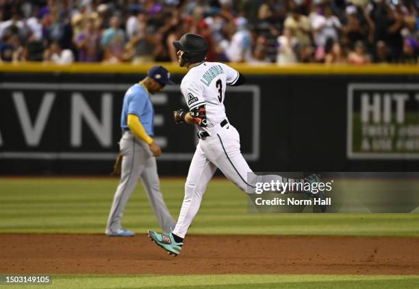 Evan Longoria of the Arizona Diamondbacks rounds the bases after hitting a solo home run against the Tampa Bay Rays during the third inning at Chase...
