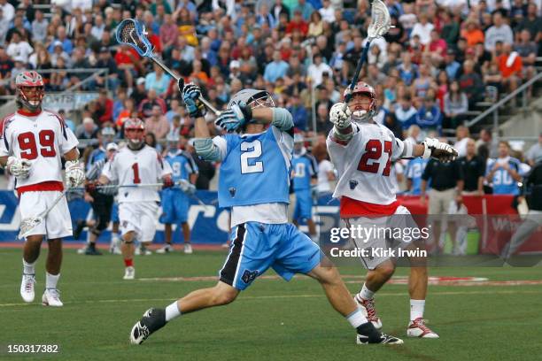 Kevin Buchanan of the Boston Cannons attempts to block a shot from Dan Groot of the Ohio Machine on August 11, 2012 at Selby Stadium in Delaware,...